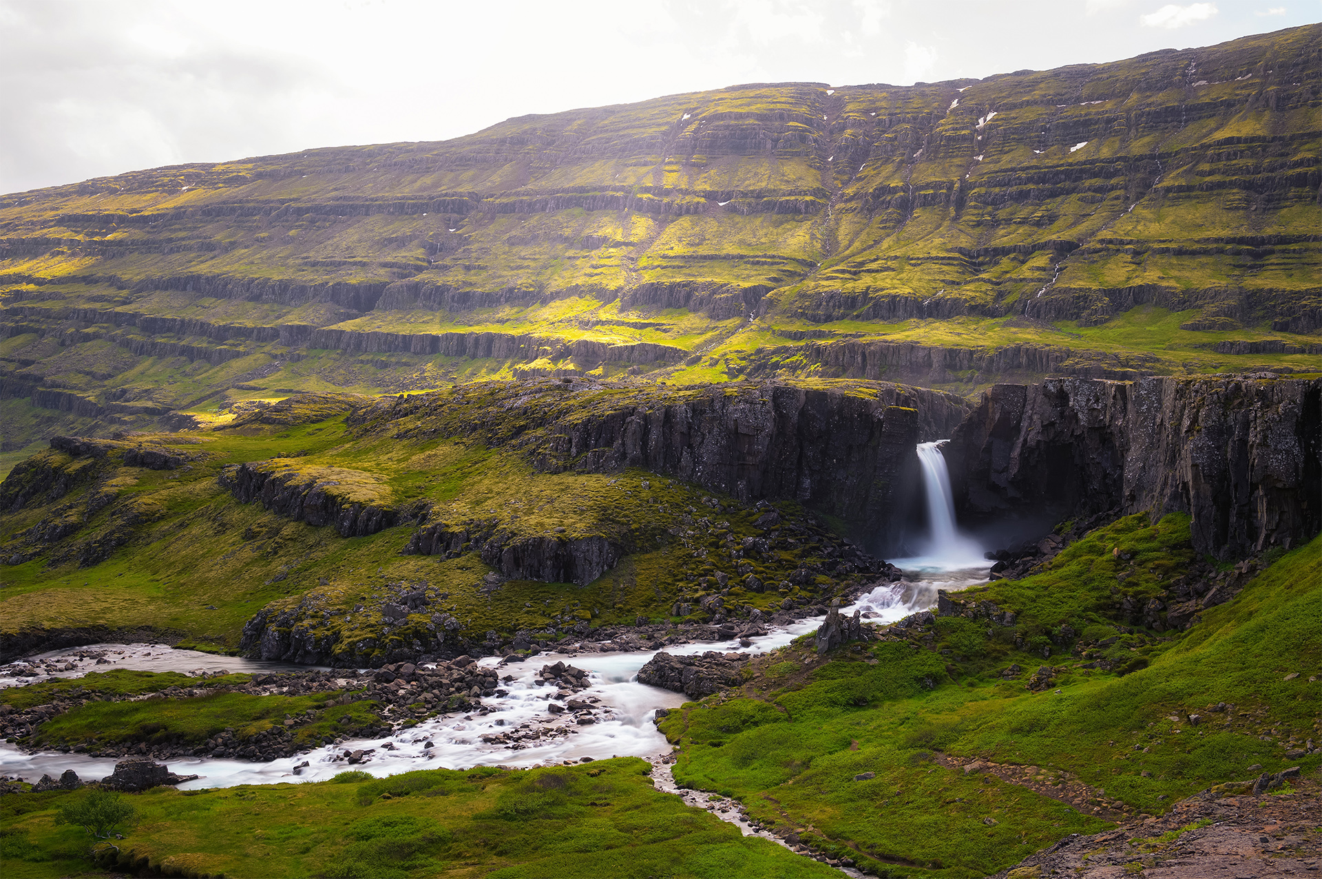 Aerial view of the Folaldafoss waterfall in Berufjardara river located in the east of Iceland. Long exposure.